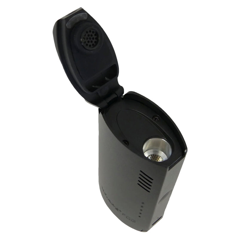 X-VAPE FOG Portable Vaporizer on a table, illustrating its compact design and user-friendly interface.