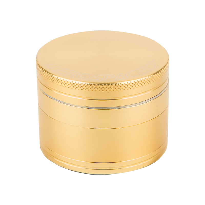 Top view of the aluminum herb grinder showcasing razor-sharp teeth and mesh sifter