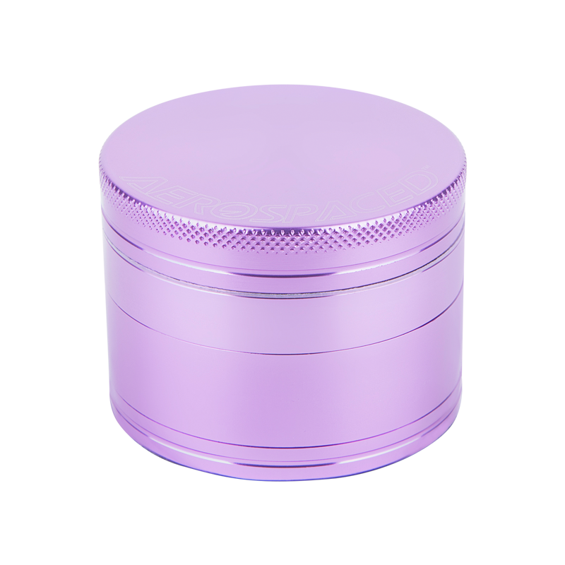 Aerospaced 4-piece aluminum herb grinder with magnetic lid and kief catcher in use