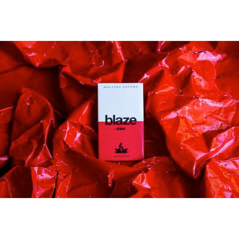 Close-up view of Shine Blaze Premium King Size Rolling Papers highlighting the fine texture of each sheet.