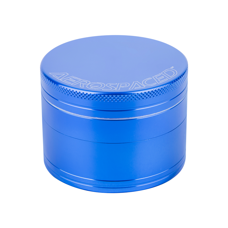 Top view of the aluminum herb grinder showcasing razor-sharp teeth and mesh sifter