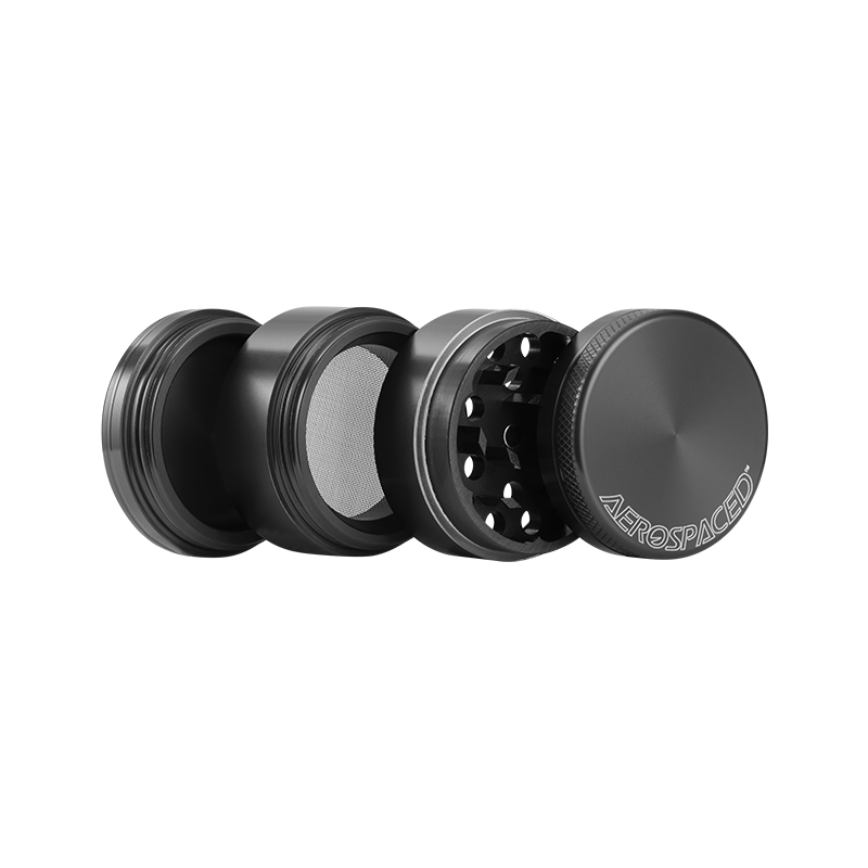 Close-up of Aerospaced herb grinder with diamond teeth and anodized finish