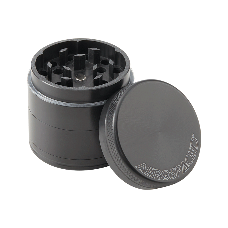 Herb grinder with pollen catcher in use, shredding herbs smoothly