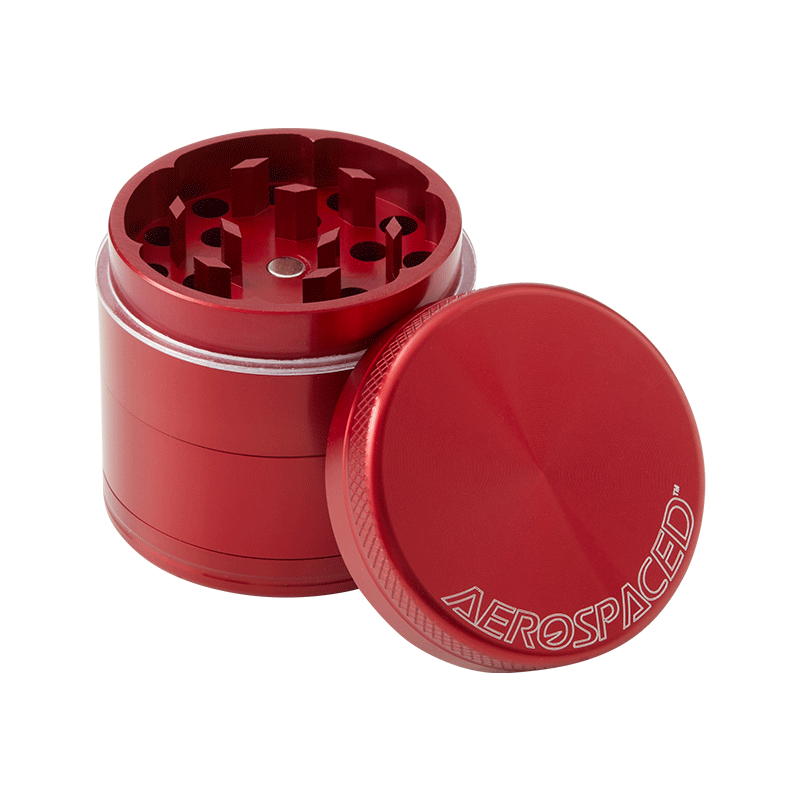 Herb grinder with pollen catcher in use, shredding herbs smoothly