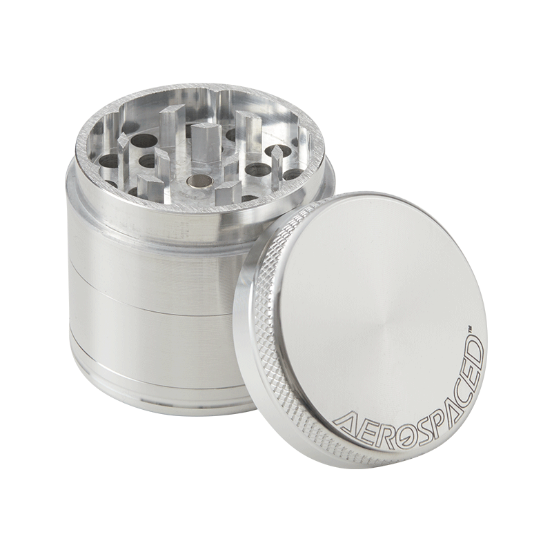 Close-up of Aerospaced herb grinder with diamond teeth and anodized finish