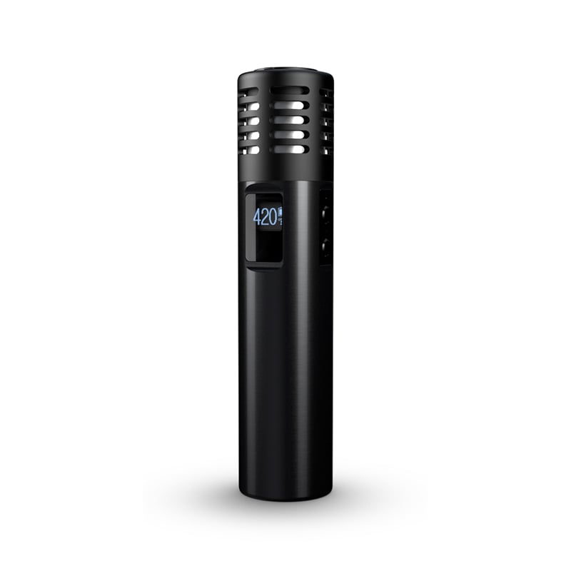 Hand holding the affordable multi-purpose vaporizer in outdoor sunlight for portable use