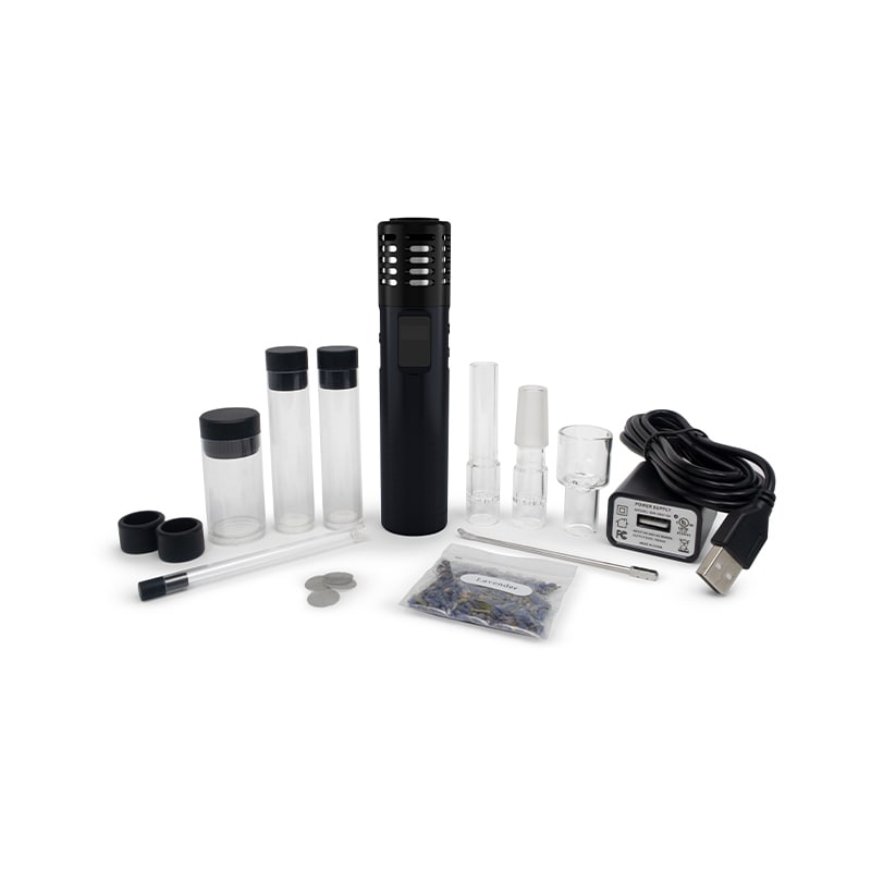 Hand holding the affordable multi-purpose vaporizer in outdoor sunlight for portable use