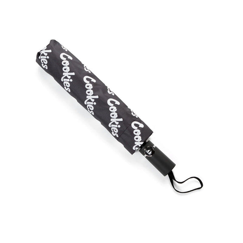 Stylish logo compact umbrella open showing repeated Cookies logo design from above.