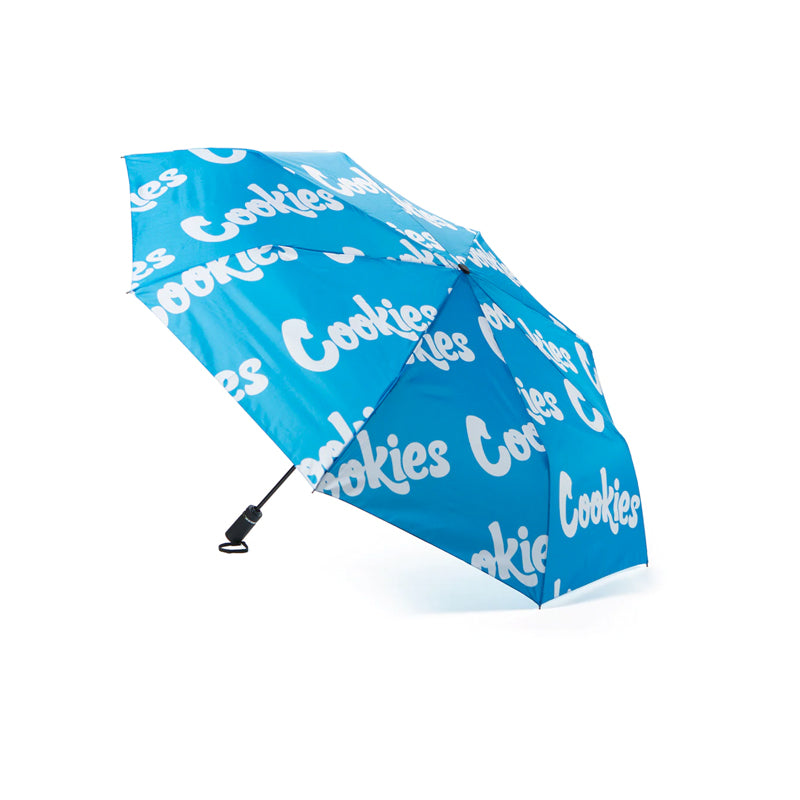 Stylish logo compact umbrella folded with carry sleeve displayed on a rainy day.