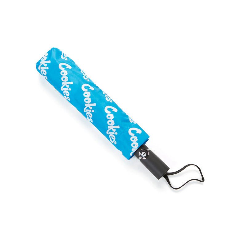 Stylish logo compact umbrella open showing repeated Cookies logo design from above.