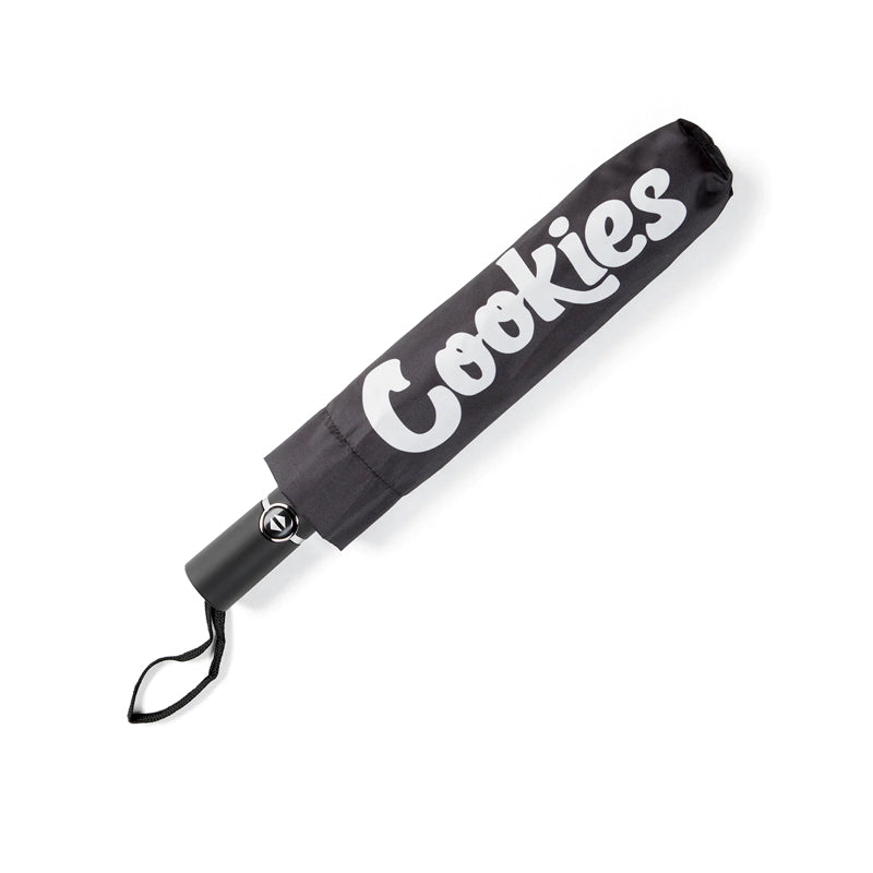 Close-up of the Cookies brand rain gear logo on the umbrella canopy