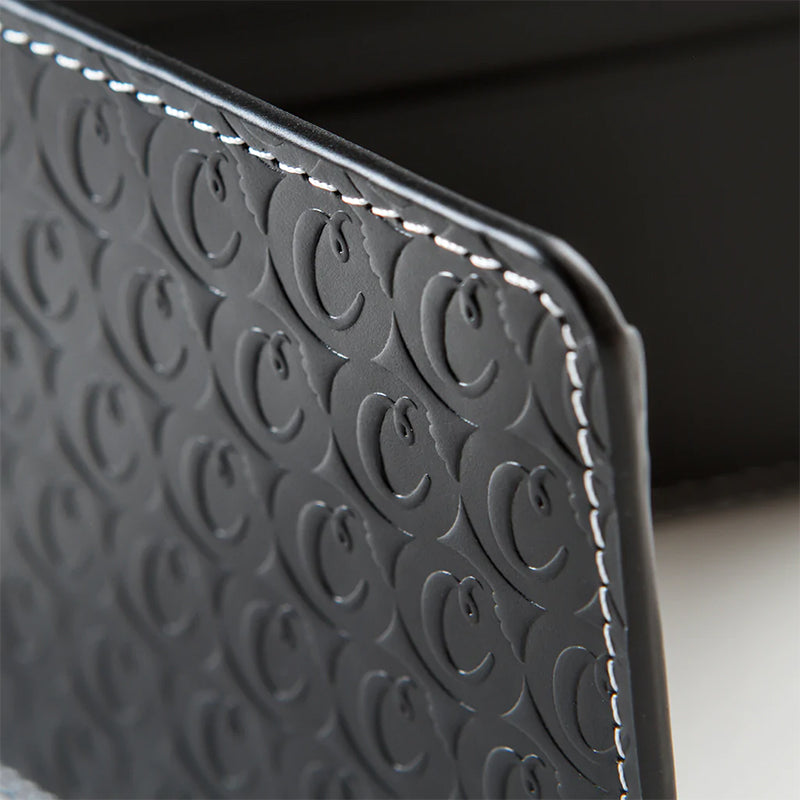 Front view of Urban Chic embossed leather billfold wallet in black, showcasing the elegant design.