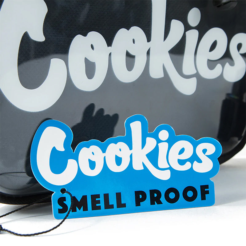 Close-up of the Cookies floatable tote with adjustable shoulder strap on sandy beach