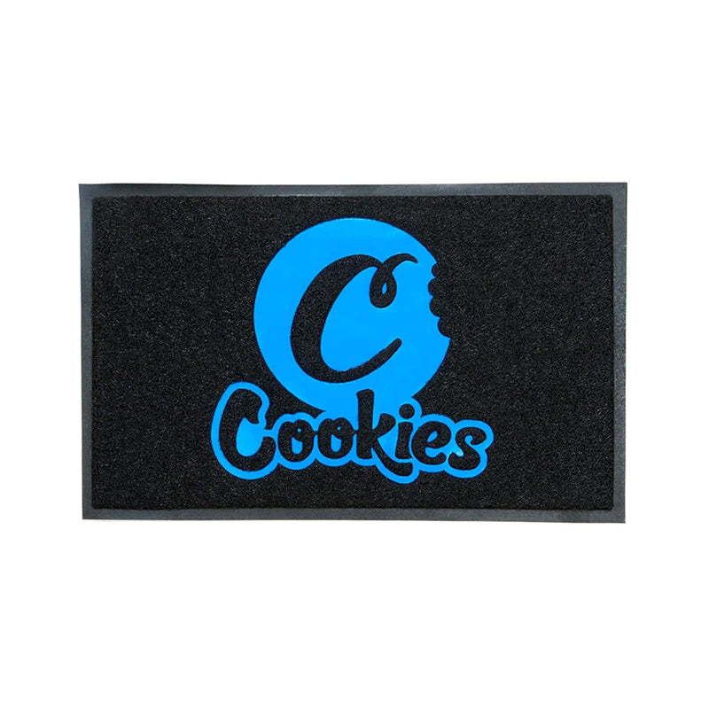 Close-up of Cookies vinyl floor mat with blue logo, showcasing its durable material and slip-resistant backing