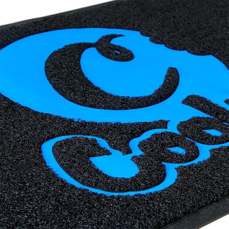 Indoor entryway with a black and blue Cookies logo rug, adding style and safety