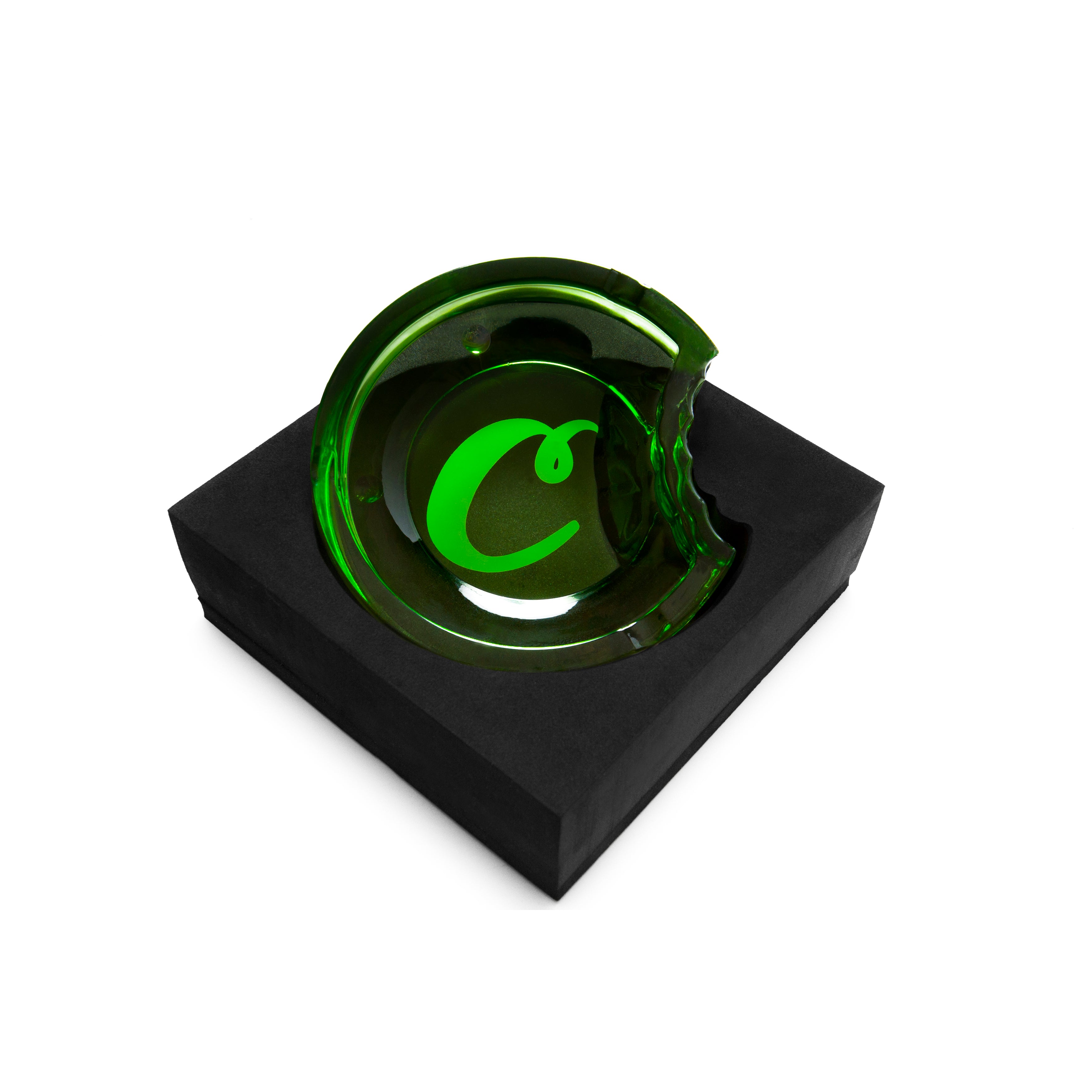 Side profile of the glass ashtray revealing its thick, heat-resistant structure and branding
