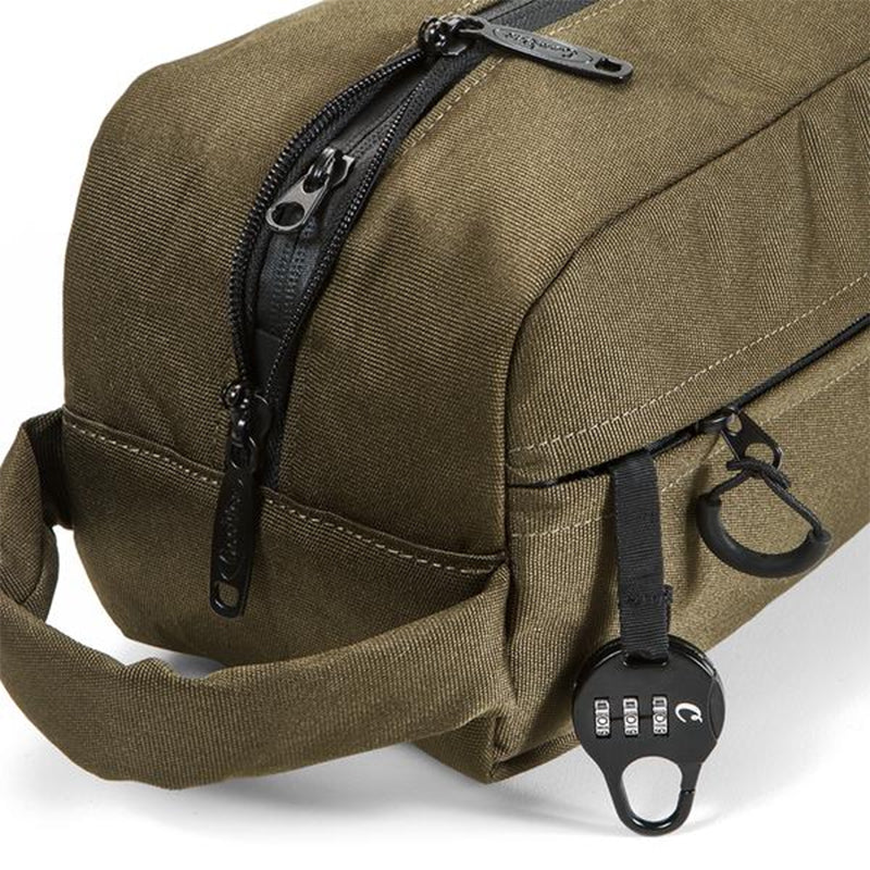 Close-up of the durable polyester canvas exterior of the toiletry bag with zipper