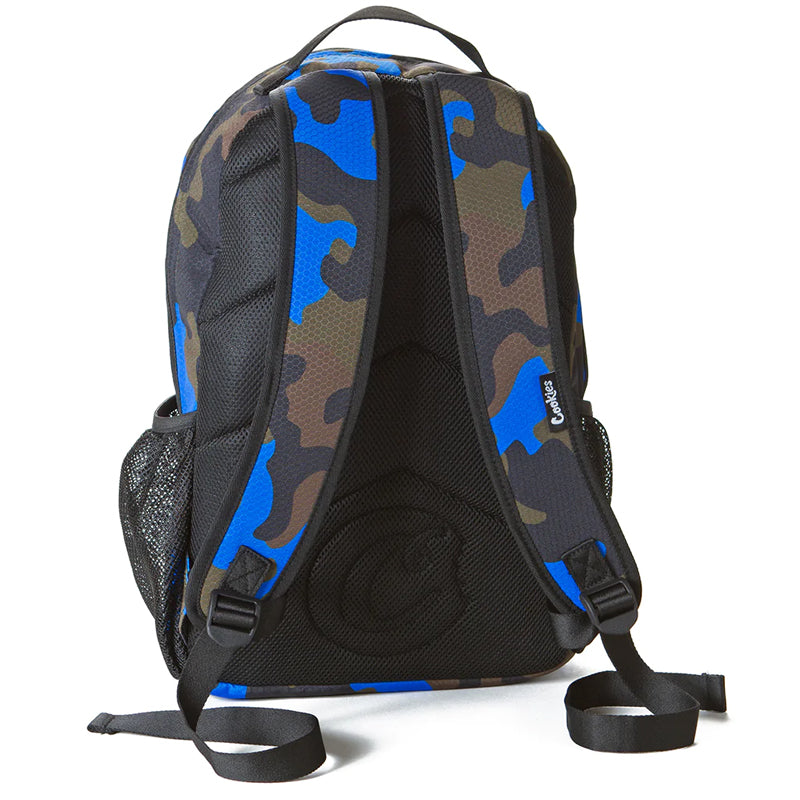 User  carrying the durable camo backpack during an outdoor trip, showcasing its versatility.