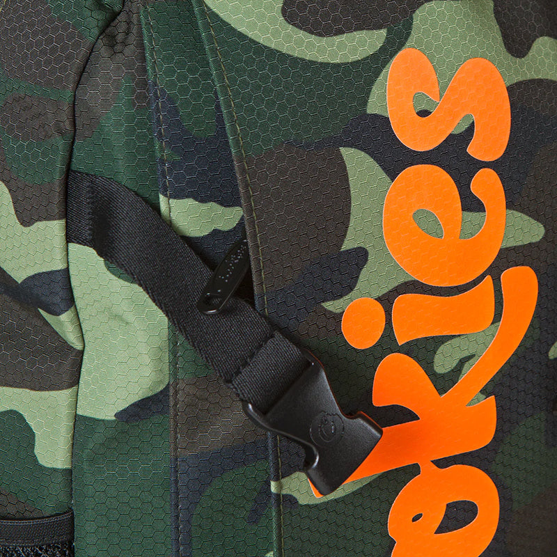 Interior view of the spacious nylon backpack with zip compartments, ideal for school supplies.