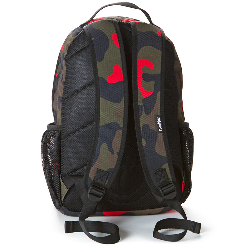 User  carrying the durable camo backpack during an outdoor trip, showcasing its versatility.