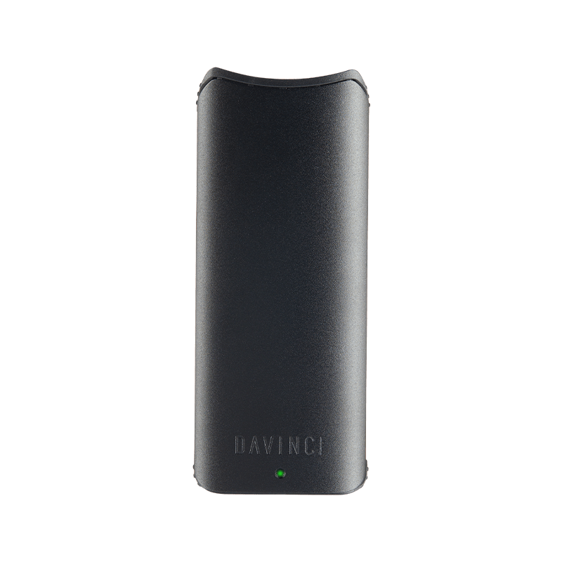 Close-up of the DaVinci ARTIQ battery with a 510 cartridge attached, emphasizing the magnetic collar feature.