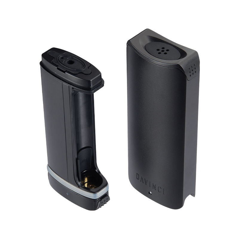 DaVinci ARTIQ vaporizer battery from the side, highlighting its compact design and USB charging port.