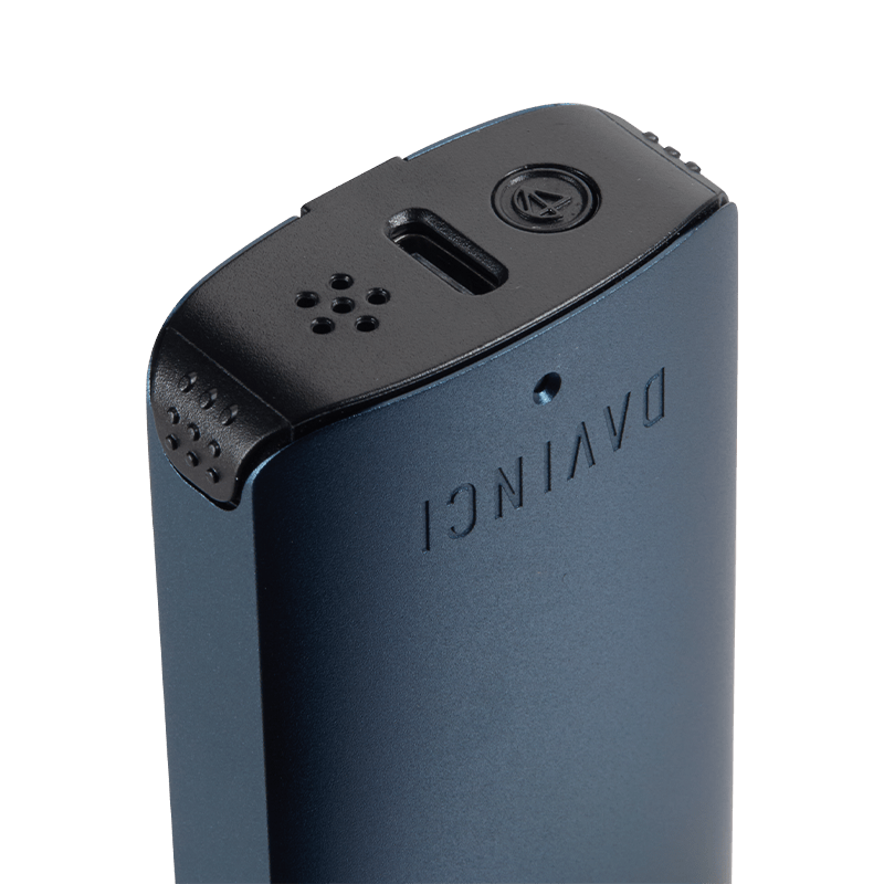 DaVinci ARTIQ vaporizer battery from the side, highlighting its compact design and USB charging port.