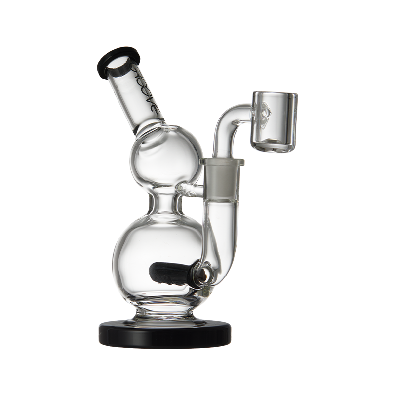 Lifestyle shot of the Groove Mini Round Concentrate Rig in use, emphasizing its compact size.