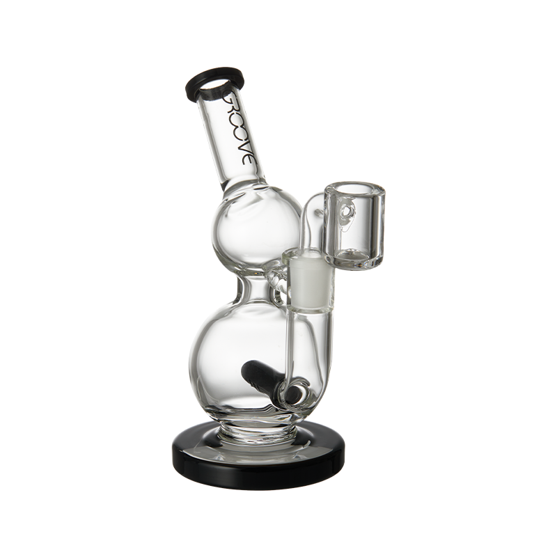 Lifestyle shot of the Groove Mini Round Concentrate Rig in use, emphasizing its compact size.