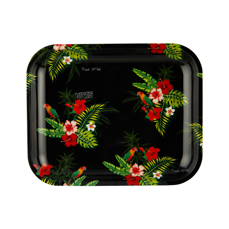 Close-up of floral design on decorative aluminum tray for serving