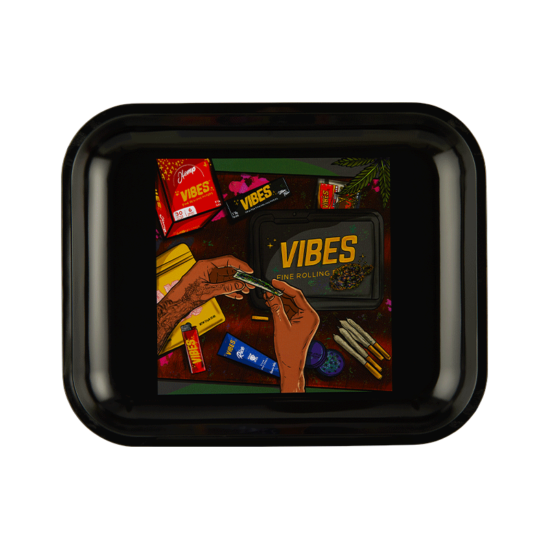 Overhead shot of Vibes aluminum tray with bold Now We Roll artwork and raised edges