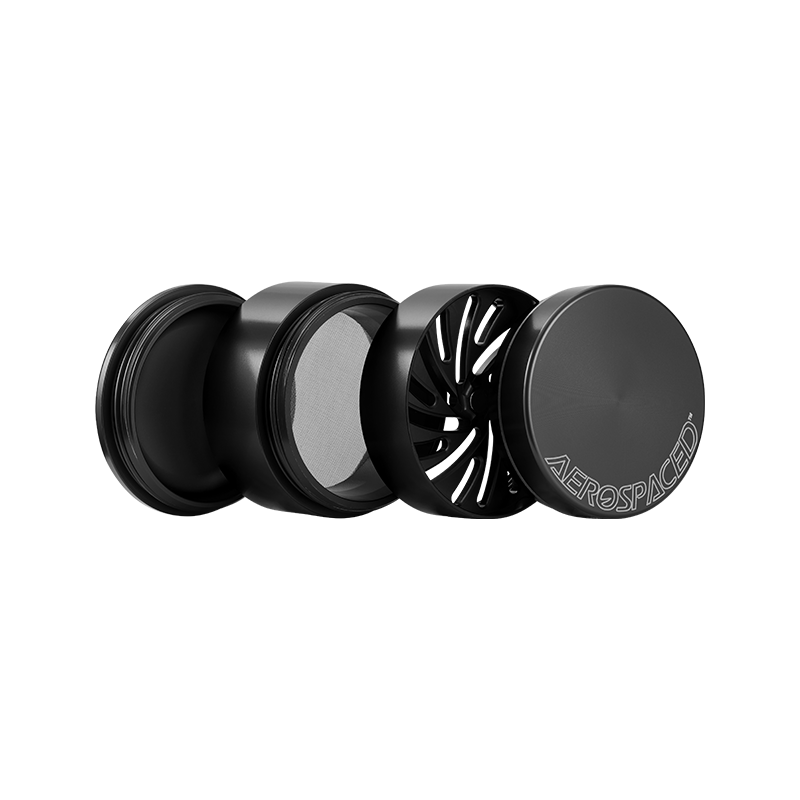 Top view of the 4-piece toothless herb grinder showcasing its sleek design and grooves for easy material placement.