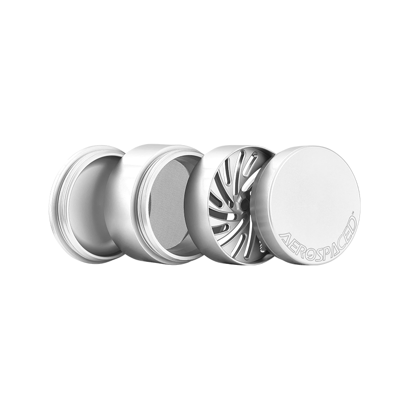 Top view of the 4-piece toothless herb grinder showcasing its sleek design and grooves for easy material placement.