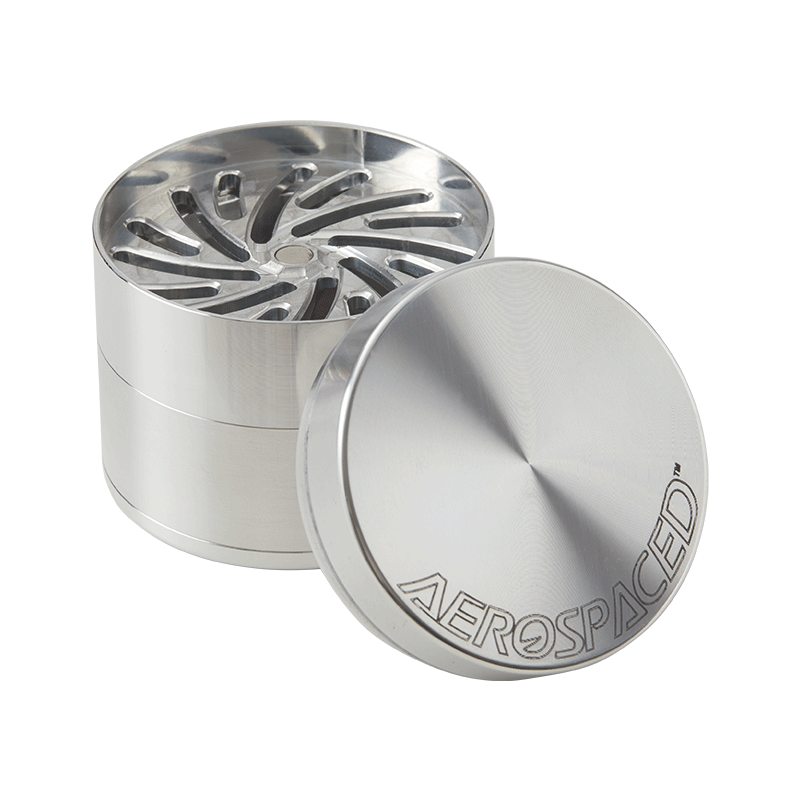 User  demonstrating the grinding process with the toothless herb grinder, showing ease of use and efficient material handling.