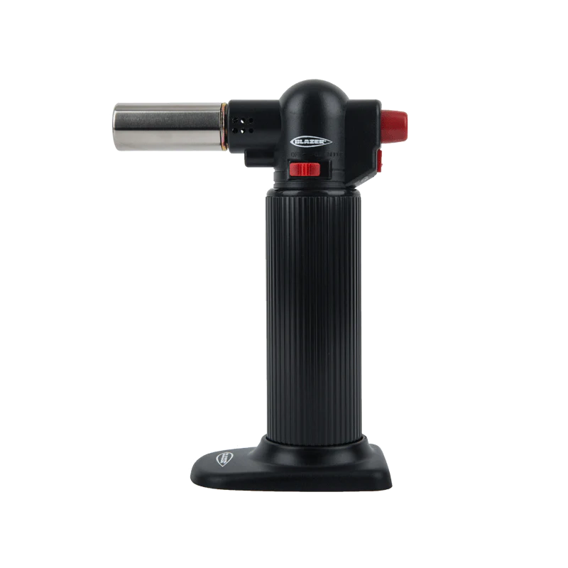 Professional kitchen torch in action during culinary preparation