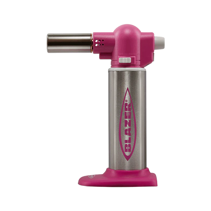 Professional kitchen torch in action during culinary preparation