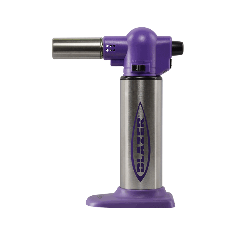Professional kitchen torch in action during culinary preparation