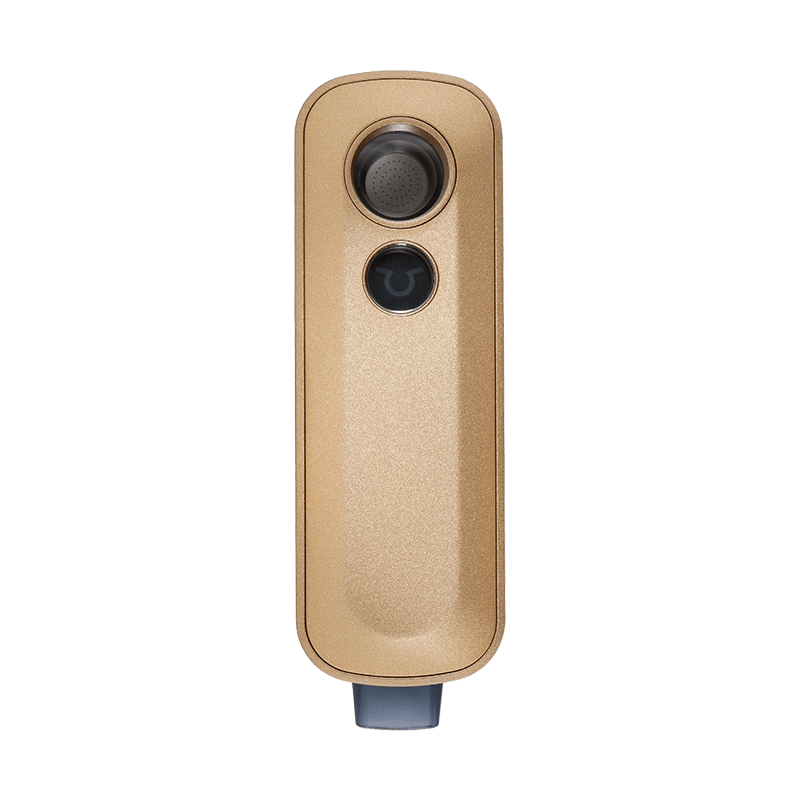 User  enjoying the Firefly 2+ vaporizer outdoors, highlighting its portability.