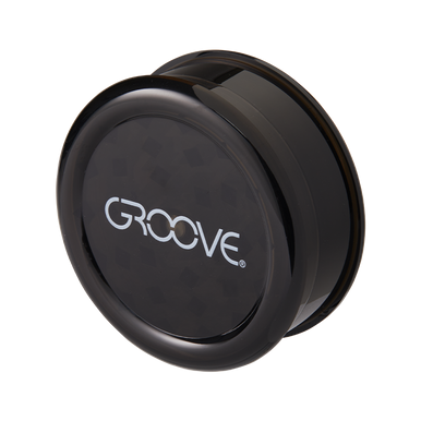 Herb grinder in use, grinding fresh herbs for on-the-go use