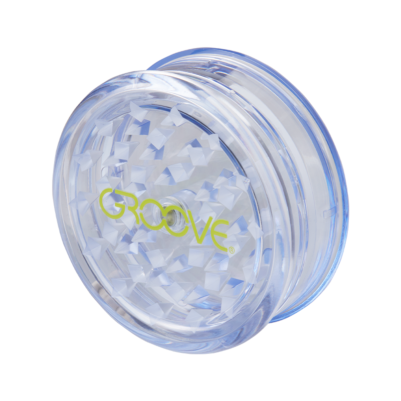 Colorful portable acrylic grinder packed for travel