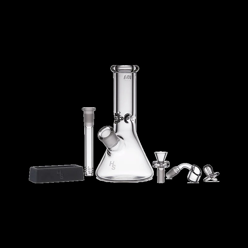 User  enjoying smooth hits from the Premium Mini Beaker Bong in an outdoor setting.