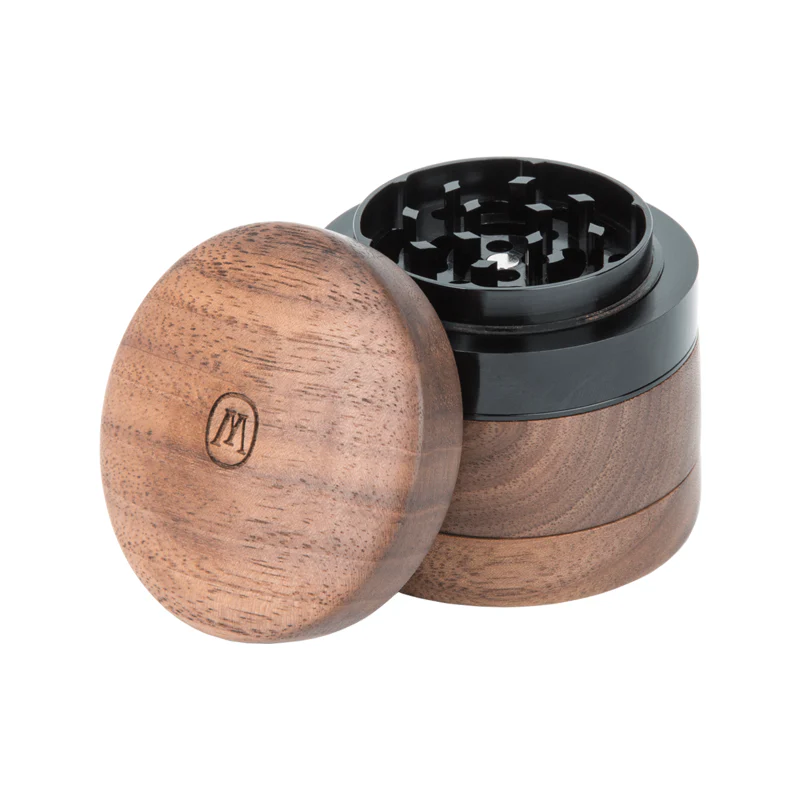 Black walnut herb grinder with aluminum teeth and magnetic lid, ideal for on-the-go use