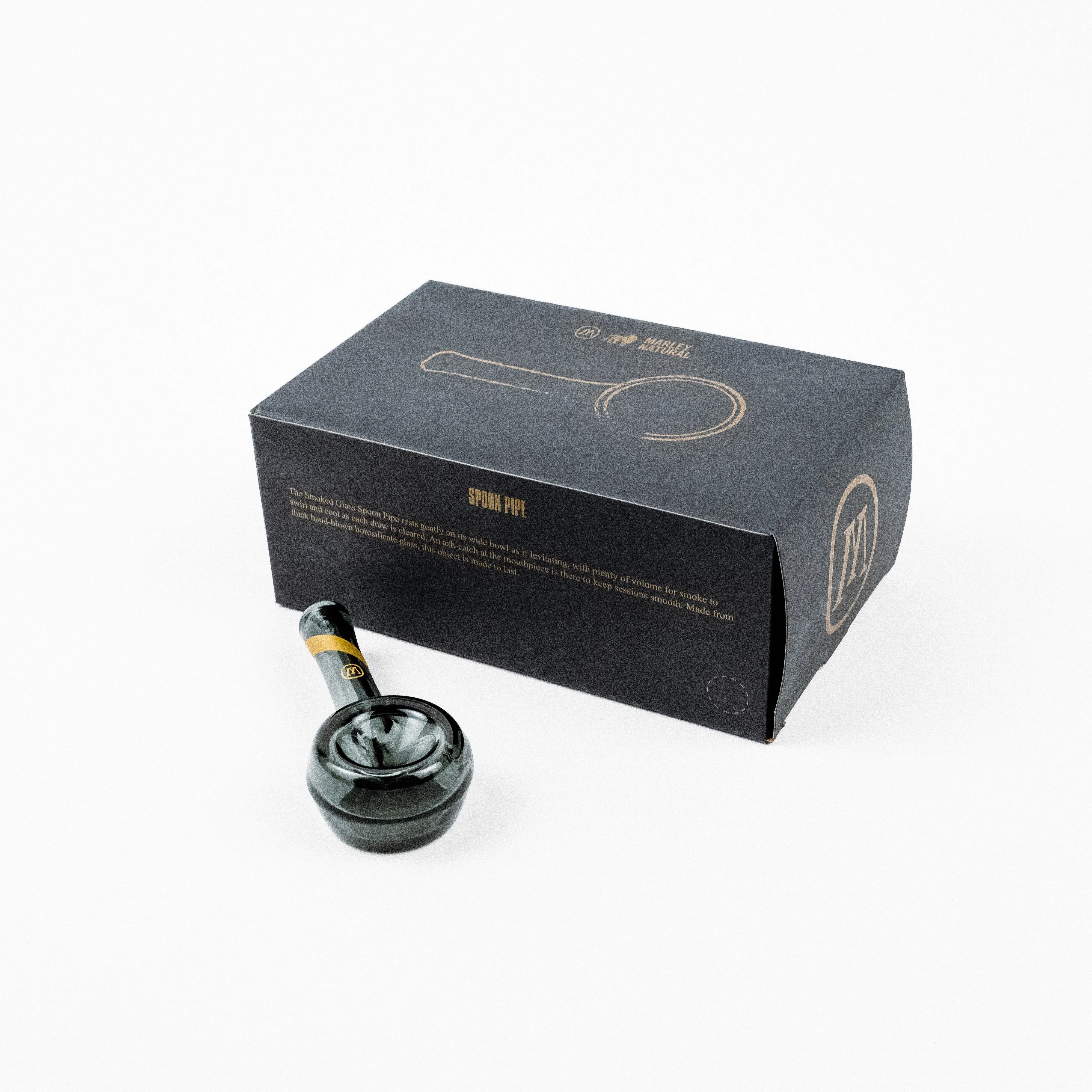 Side view of hand-blown glass pipe showing gold stripe detail and wide bowl