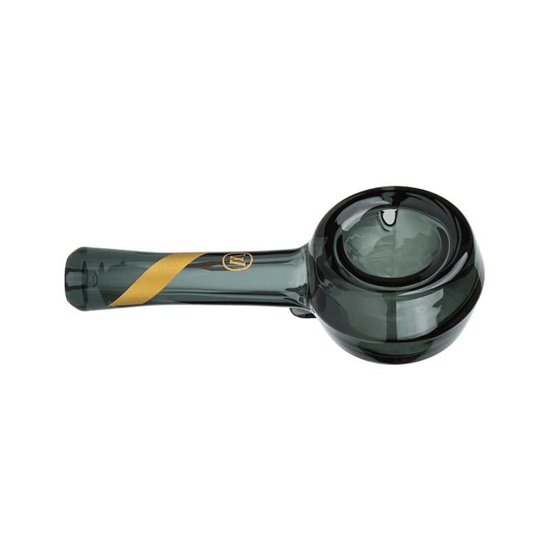 Close-up of smoked glass spoon pipe with gold stripe decal and flower bowl