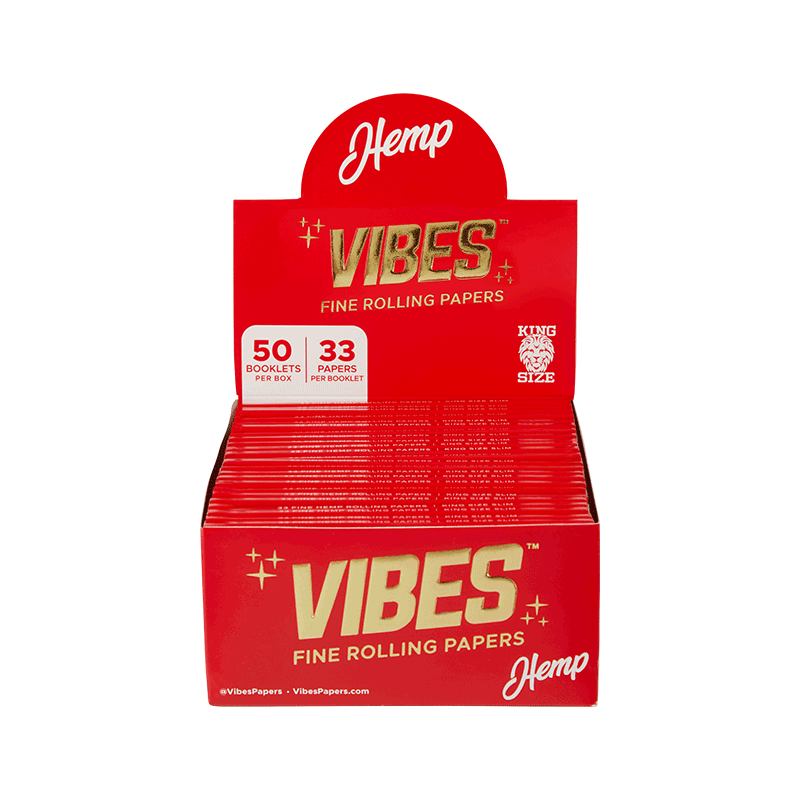 User  rolling a joint with Vibes Premium King Size Slim Rolling Papers, emphasizing ease of use.