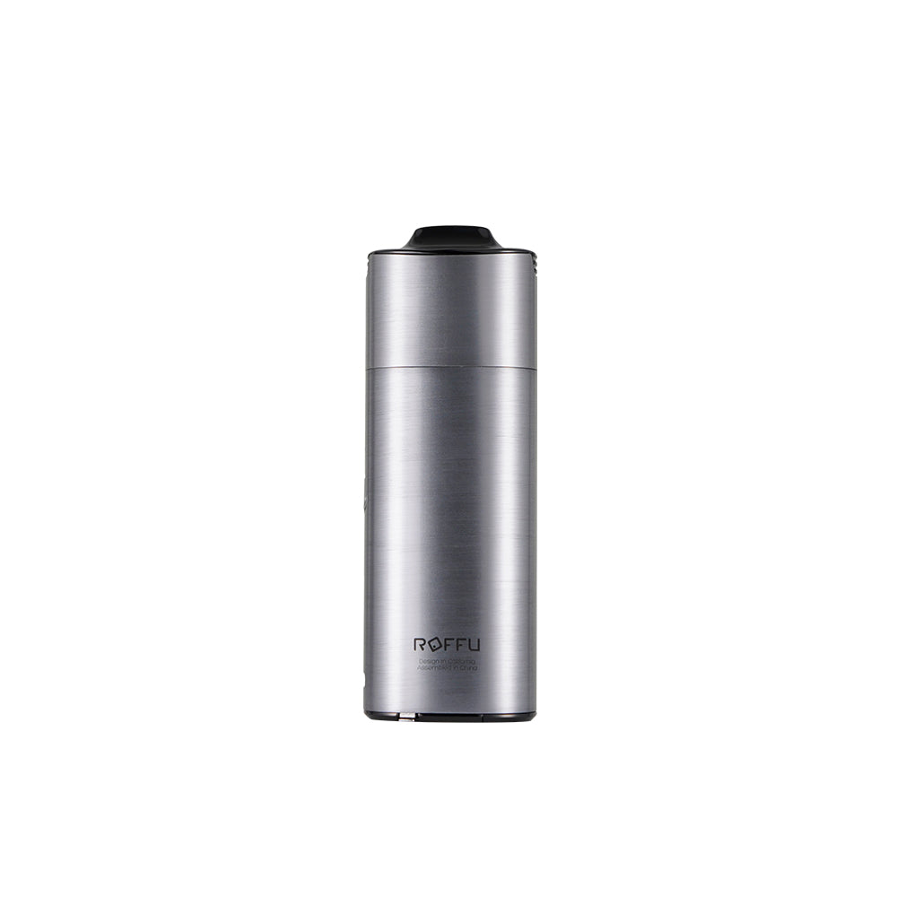 User holding the XVAPE Roffu Lite vaporizer for dry herbs outdoors