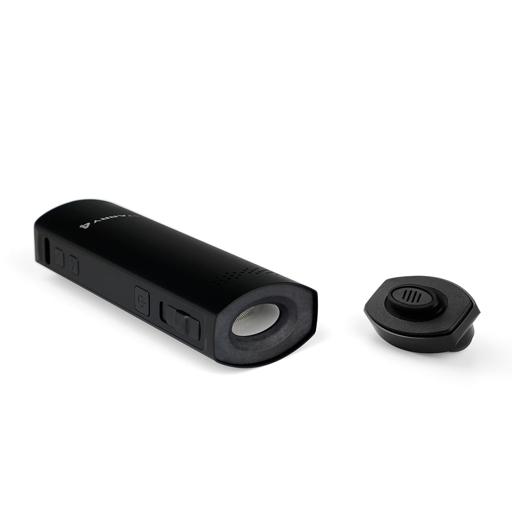User holding the portable herb vaporizer with replaceable battery for on-the-go vaping