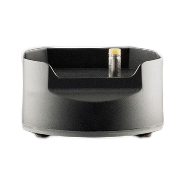 Arizer Solo vaporizer on its charging dock with a modern background