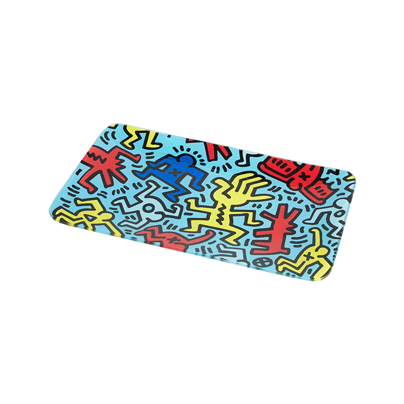 Close-up of Keith Haring inspired glass rolling tray with vibrant artwork