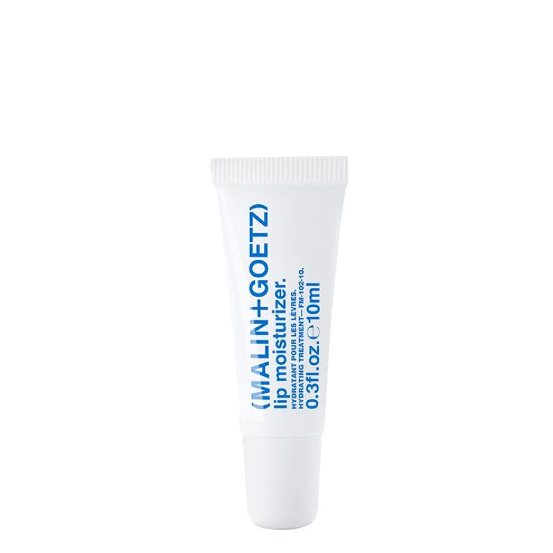 Close-up of VelvetHydrate™ lip balm tube on marble counter, showcasing its sleek design and natural formula